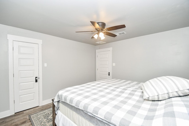 bedroom featuring hardwood / wood-style floors and ceiling fan