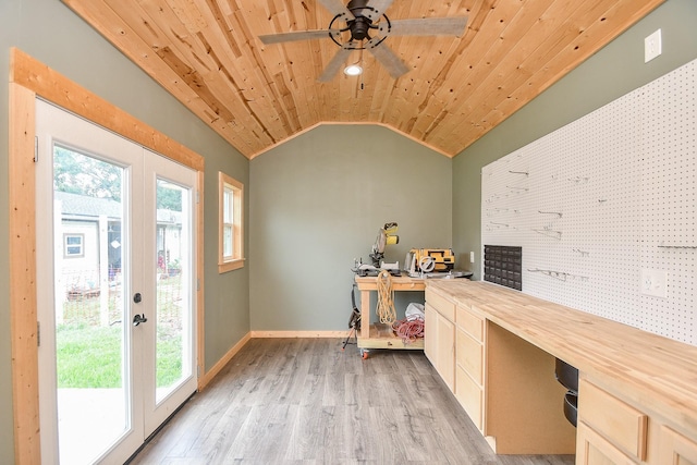 home office featuring french doors, lofted ceiling, light hardwood / wood-style floors, and wooden ceiling