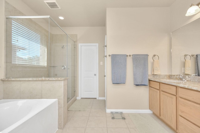 9614 Hideaway Green Dr, Richmond, TX 77406 - bathroom with tile patterned floors, vanity, a shower stall, a bath, and visible vents