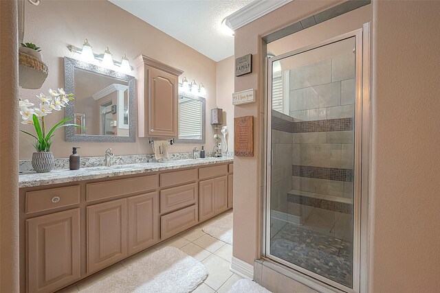 bathroom with vanity, tile patterned floors, and walk in shower