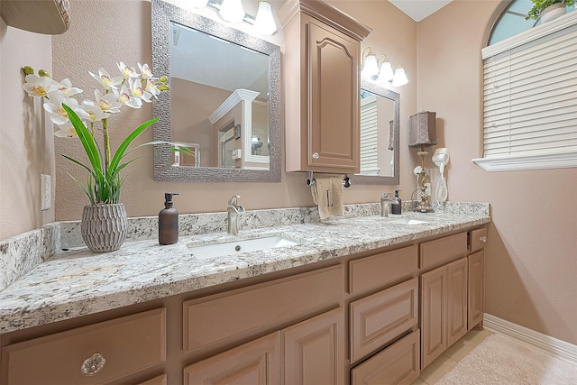 bathroom with vanity and tile patterned flooring