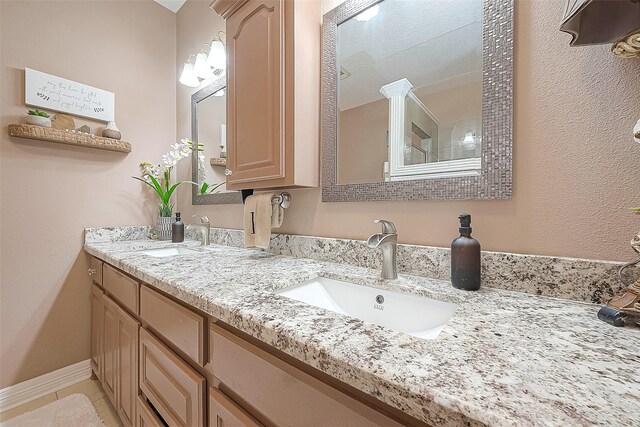 bathroom featuring vanity and tile patterned flooring