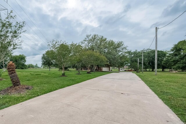 surrounding community featuring a yard