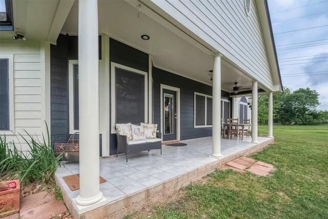 view of patio featuring ceiling fan