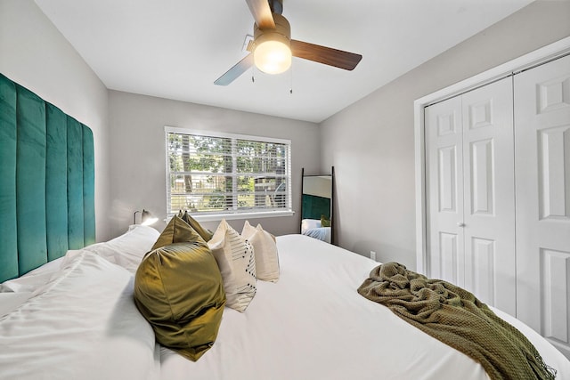 bedroom with ceiling fan and a closet