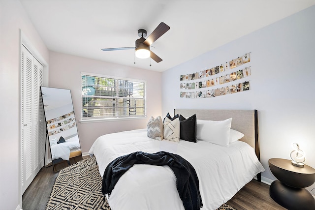 bedroom with ceiling fan, dark hardwood / wood-style flooring, and a closet