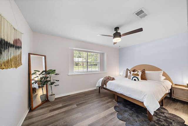 bedroom featuring dark hardwood / wood-style floors and ceiling fan