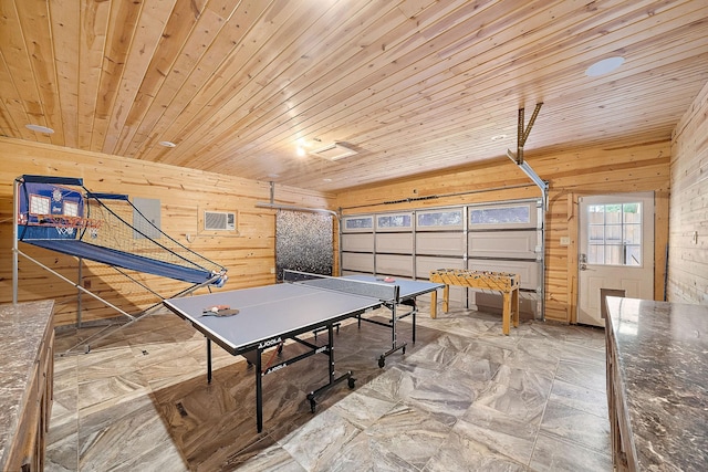 playroom with wooden walls and wood ceiling