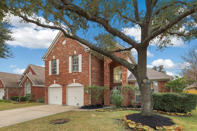 front of property with a garage and a front lawn