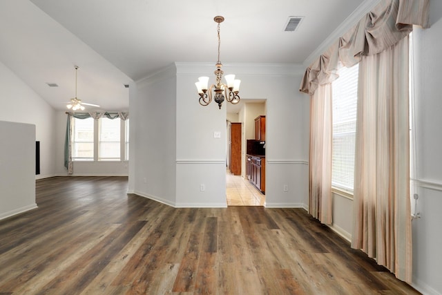 unfurnished dining area featuring dark hardwood / wood-style floors, plenty of natural light, and crown molding