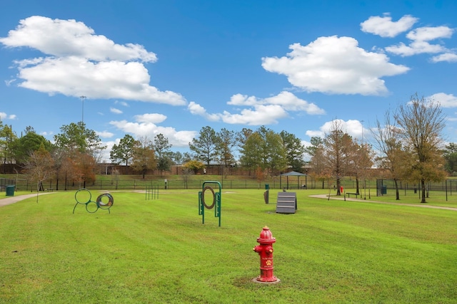 view of property's community with a lawn