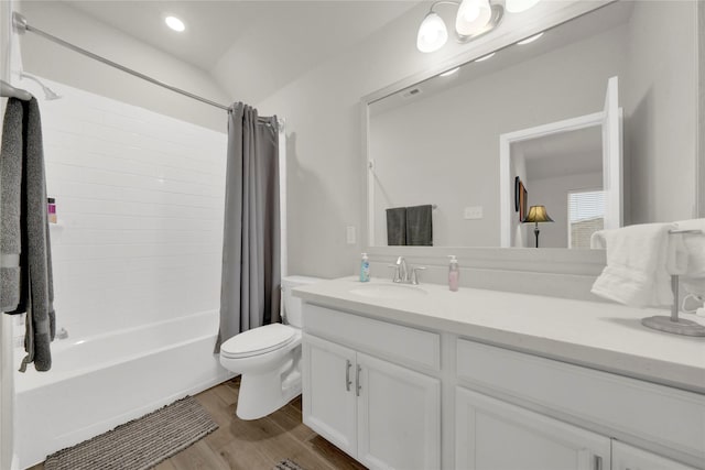 full bathroom featuring toilet, vanity, shower / bath combo, and hardwood / wood-style flooring