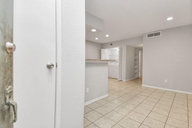 empty room with light tile patterned floors