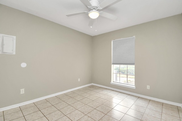 empty room featuring ceiling fan and light tile patterned floors