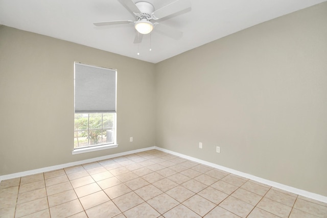 tiled empty room with ceiling fan