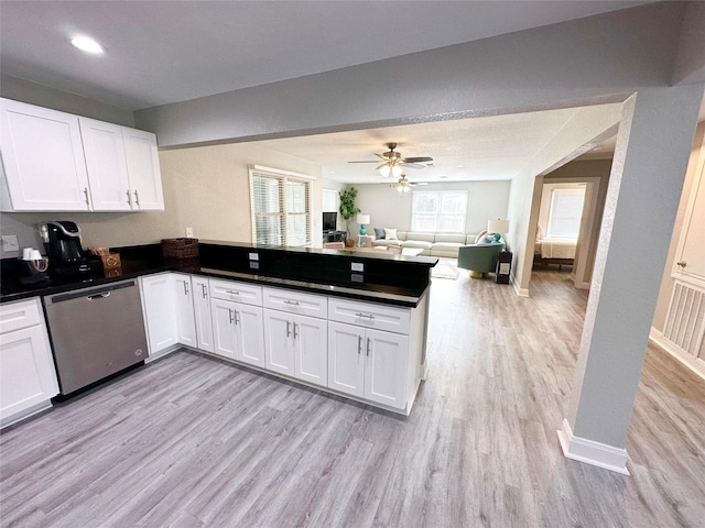 kitchen featuring kitchen peninsula, ceiling fan, light hardwood / wood-style flooring, dishwasher, and white cabinetry