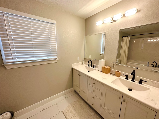 bathroom featuring vanity, a textured ceiling, tile patterned floors, and shower / bath combo with shower curtain