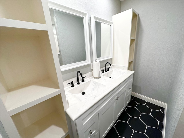 bathroom with tile patterned flooring and vanity