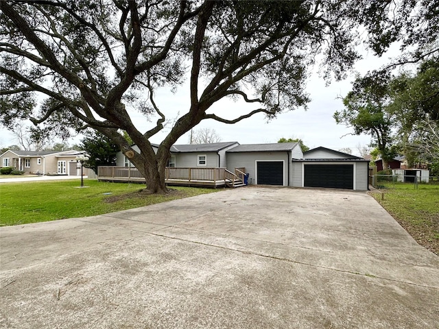 ranch-style home with a garage and a front lawn