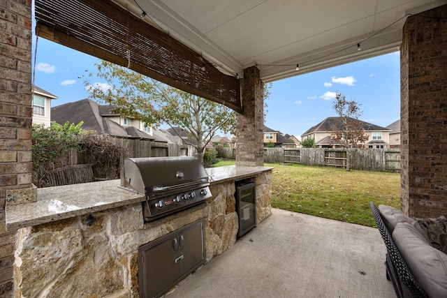 view of patio / terrace featuring an outdoor kitchen and area for grilling