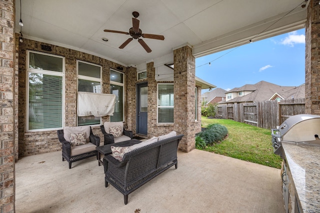 view of patio / terrace featuring an outdoor hangout area, ceiling fan, and an outdoor kitchen