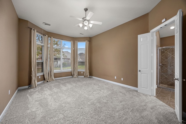 empty room with light carpet and ceiling fan