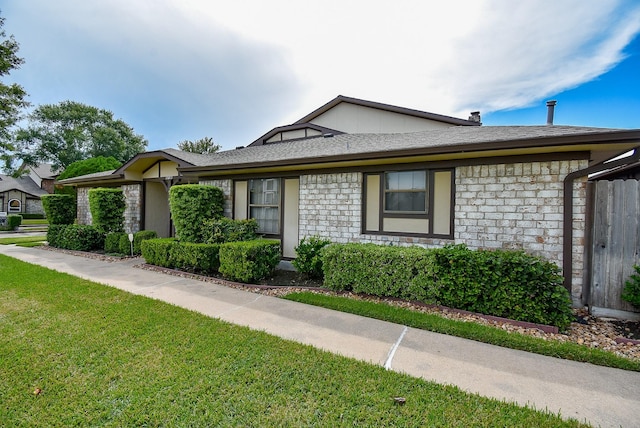 ranch-style house with a front yard