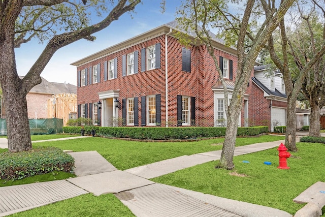 view of front facade with a garage and a front yard