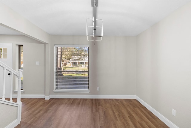 unfurnished dining area featuring hardwood / wood-style floors