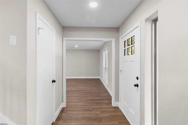 hallway featuring dark hardwood / wood-style floors