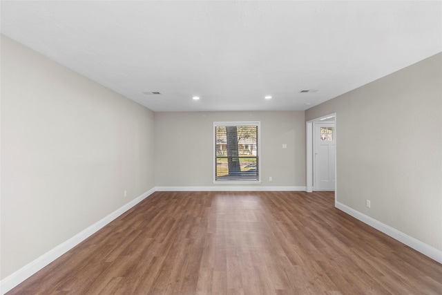 unfurnished room with light hardwood / wood-style floors