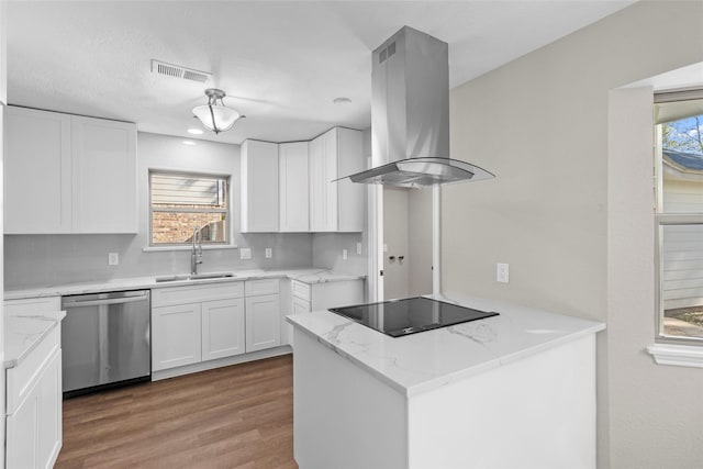 kitchen with black electric stovetop, island range hood, sink, dishwasher, and white cabinetry