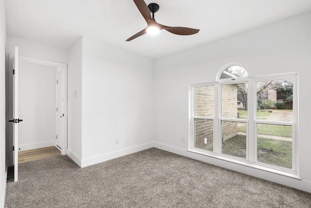 unfurnished room featuring carpet and ceiling fan