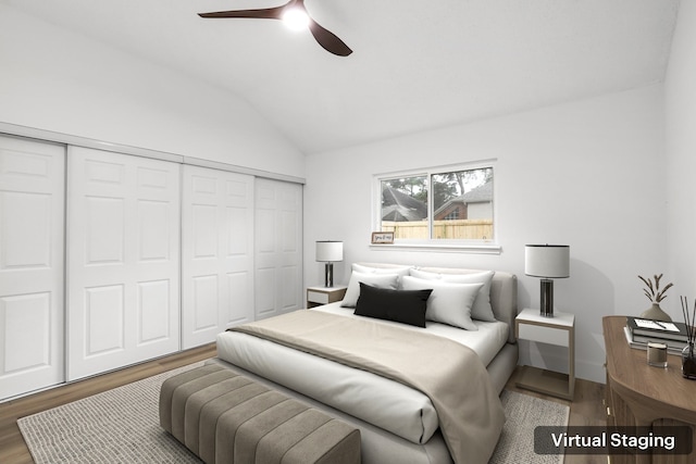 bedroom featuring dark wood-type flooring, a closet, lofted ceiling, and ceiling fan