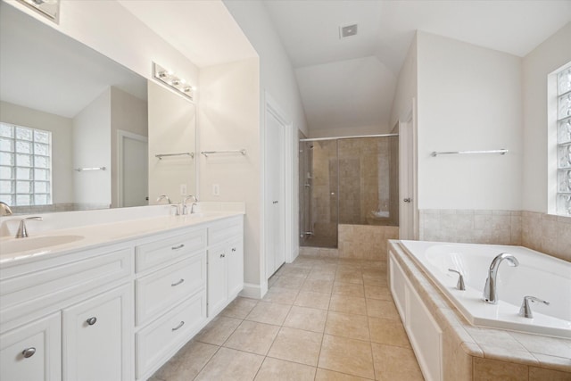 bathroom with tile patterned floors, separate shower and tub, and vanity