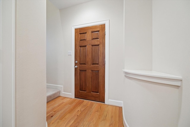 doorway to outside with hardwood / wood-style floors