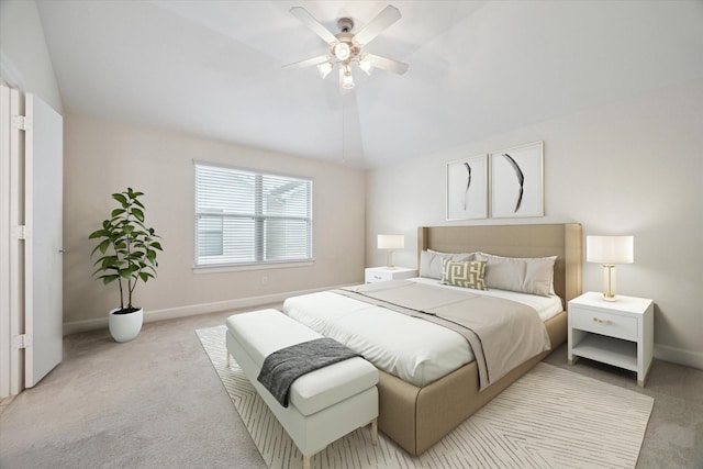 bedroom with light carpet, vaulted ceiling, and ceiling fan