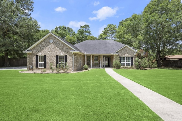 ranch-style home featuring a front lawn