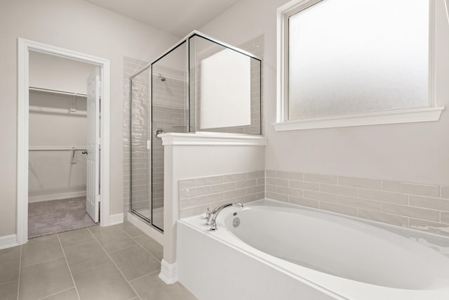 bathroom with tile patterned flooring and independent shower and bath