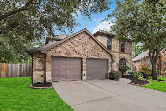 view of front of house featuring a front lawn and a garage