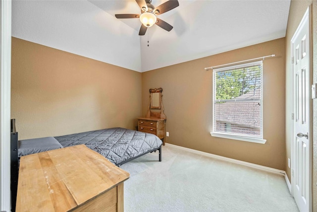 carpeted bedroom with ceiling fan and lofted ceiling