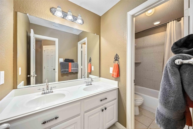 full bathroom featuring tile patterned flooring, shower / bath combo, vanity, and toilet