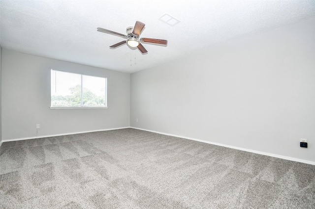 carpeted empty room with a textured ceiling and ceiling fan