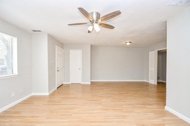 unfurnished room with ceiling fan and light hardwood / wood-style flooring