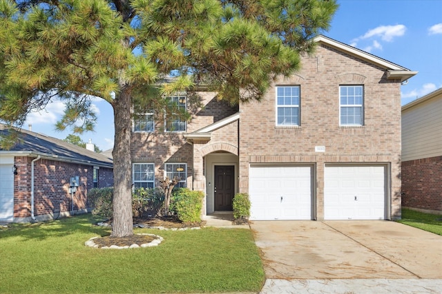 view of front of property with a garage and a front yard