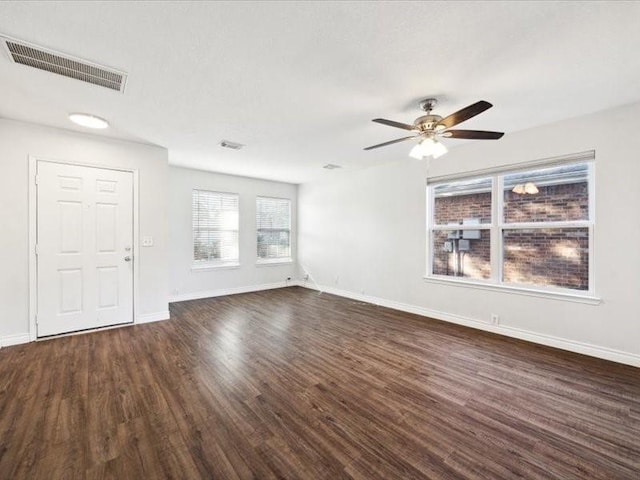 interior space with ceiling fan and dark wood-type flooring