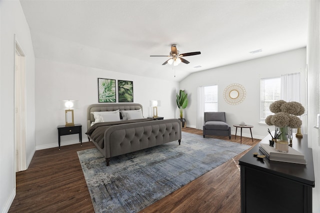 bedroom featuring ceiling fan, lofted ceiling, and dark wood-type flooring