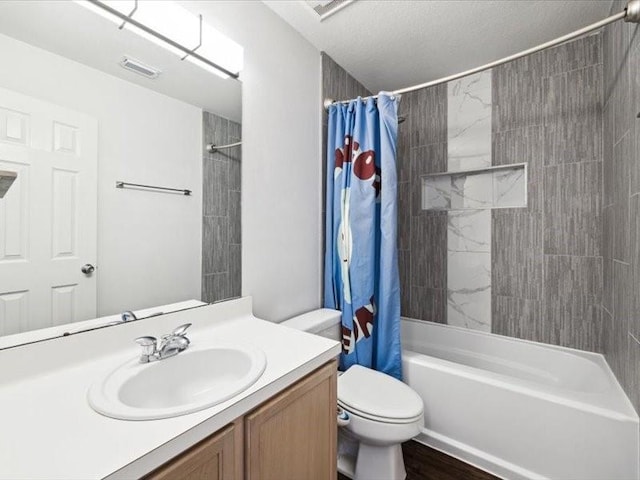 full bathroom with vanity, toilet, and shower / bath combo with shower curtain