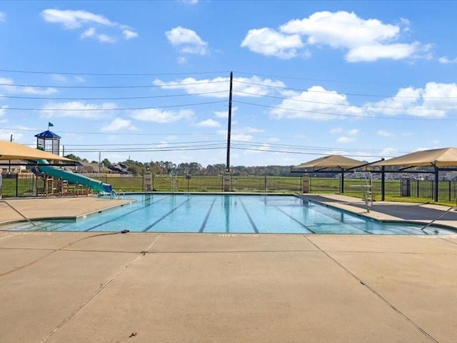 view of pool featuring a water slide