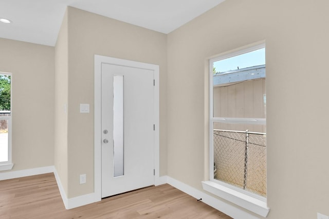 entryway with light hardwood / wood-style flooring